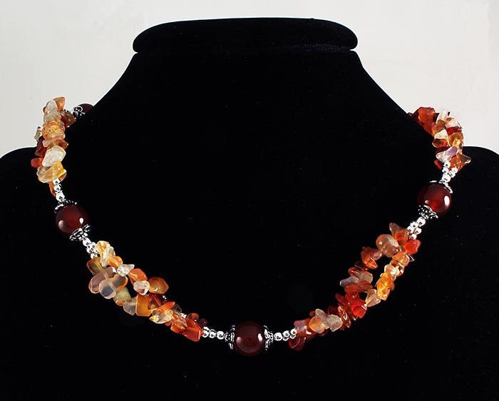 269.55CTW CARNELIAN CHIPS NECKLACE W/ METAL LOCK: 269.55CTW CARNELIAN CHIPS NECKLACE W/ METAL LOCK **|**|** 18 INCHES LONG FREEFORM CHIP BEAD NECKLACE HANDMADE WITH CARNELIAN GEMSTONE ; MSRP: $100