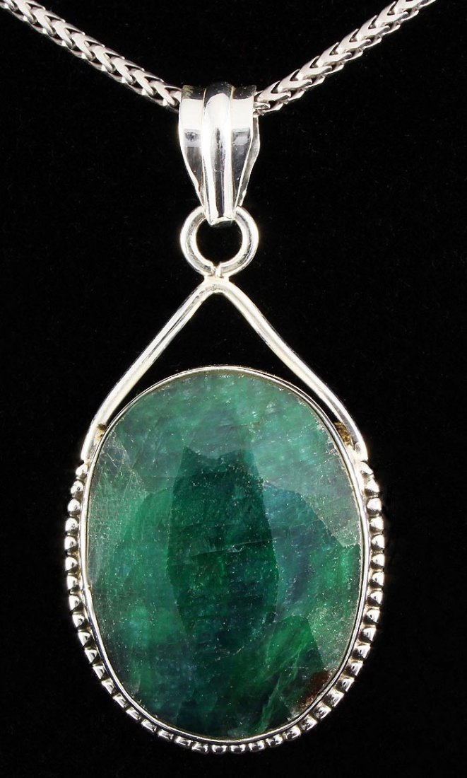 NATURAL EMERALD BERYL 59.75CTW SILVER PENDANT: NATURAL EMERALD BERYL 59.75CTW SILVER PENDANT **|**|** STERLING SILVER OVAL PENDANT WITH 26X20MM APPROX EMERALD BERYL GEMSTONE ; MSRP: $200