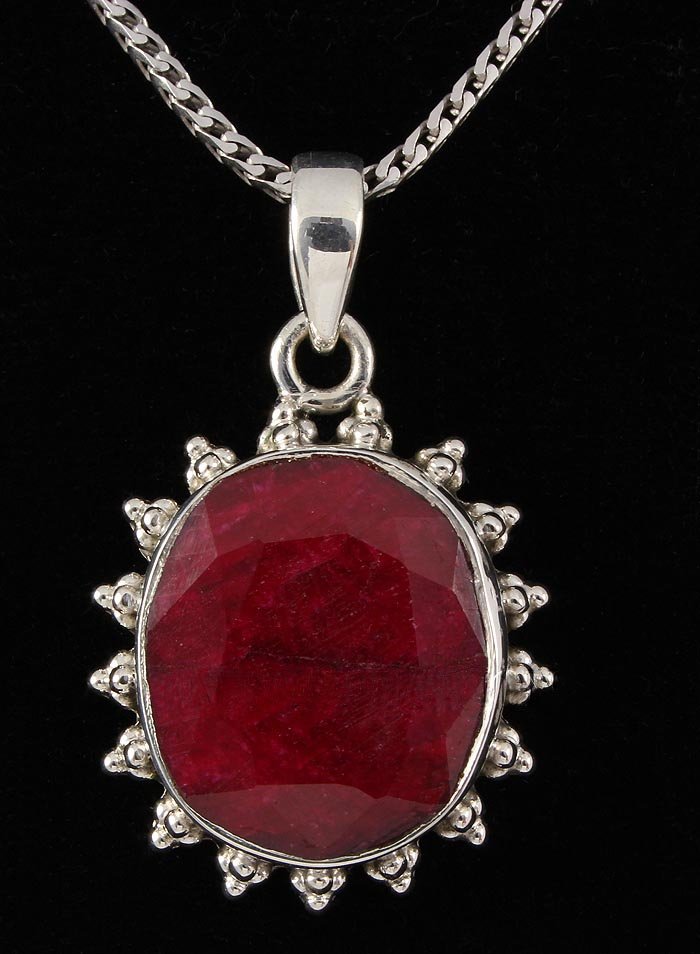 RUBY CORRUNDUM 36.42CTW STERLING SILVER PENDANT: 19X17MM OVAL SHAPE RUBY CORRUNDUM FLOWER DESIGN SILVER PENDANT