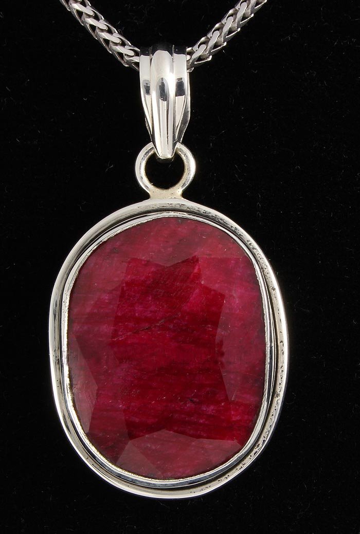 RUBY CORRUNDUM 38.94CTW STERLING SILVER PENDANT: 22X17MM OVAL SHAPE RUBY CORRUNDUM BEZEL TYPE SILVER PENDANT