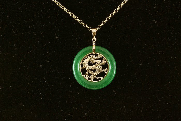 24.00ctw Good Fortune Dragon Jade Silver Pendant: 24.00ctw Good Fortune Dragon Jade Silver Pendant **|**|** Chinese Green Jade Pendant with Yellow Silver Dragon measuring 29.62x29.59mm ; MSRP: $100