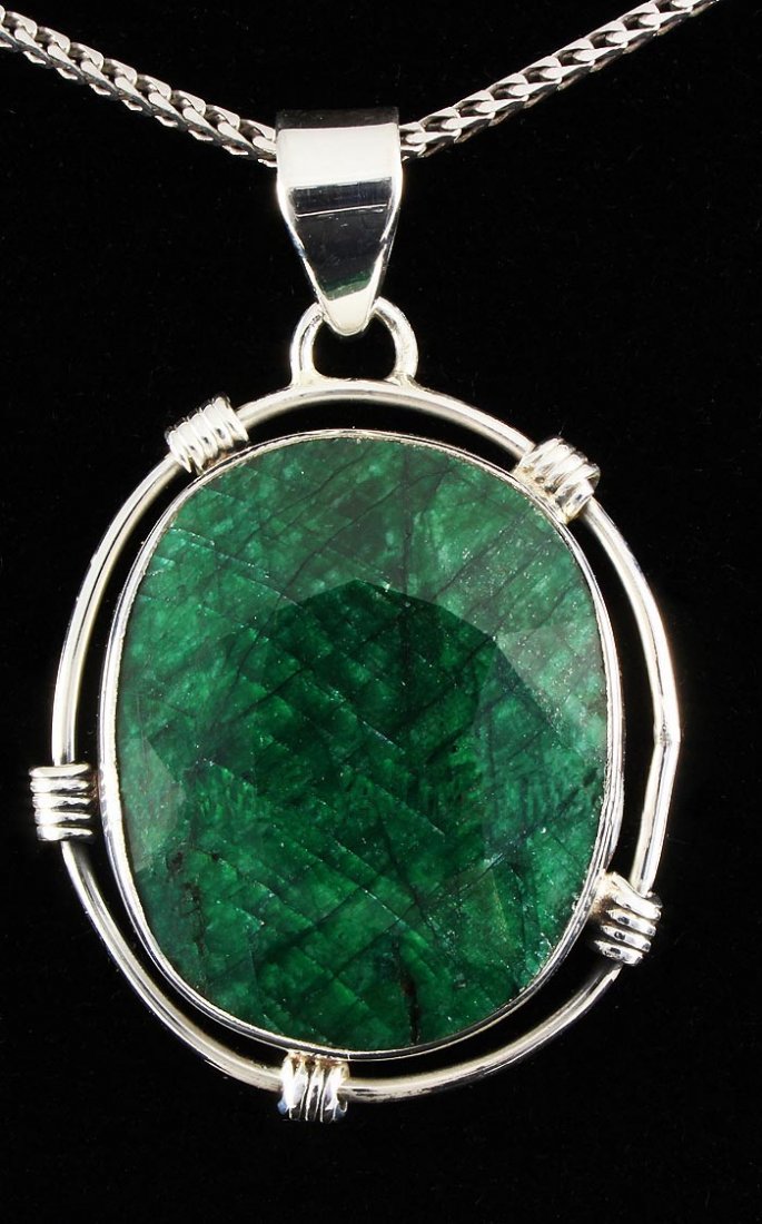 NATURAL EMERALD BERYL 58.30CTW SILVER PENDANT: NATURAL EMERALD BERYL 58.30CTW SILVER PENDANT **|**|** STERLING SILVER OVAL PENDANT WITH 26X22MM APPROX EMERALD BERYL GEMSTONE ; MSRP: $200