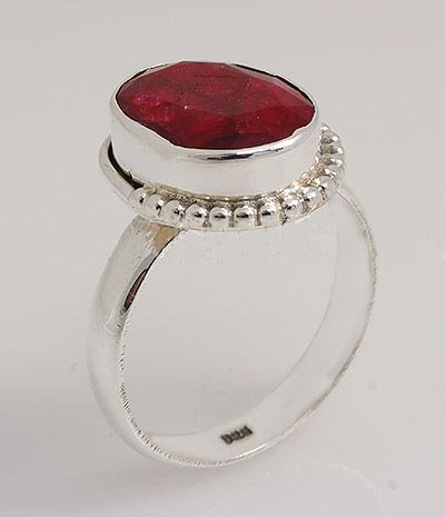 RUBY CORRUNDUM 22.56CTW CUTE DESIGN SILVER RING: RUBY CORRUNDUM 22.56CTW CUTE DESIGN SILVER RING **|**|** STERLING OVAL RING WITH 13X9MM APPROX RUBY CORRUNDUM GEMSTONE ; MSRP: $200
