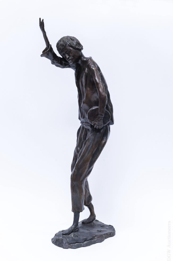 Victor Bergeron Bronze Sculpture of a Man.: Victor Bergeron (1902 - 1984), Bronze sculpture of a man holding a box in one hand and his other arm raised. Marked V. J. Bergeron. (Approx. 28" tall).