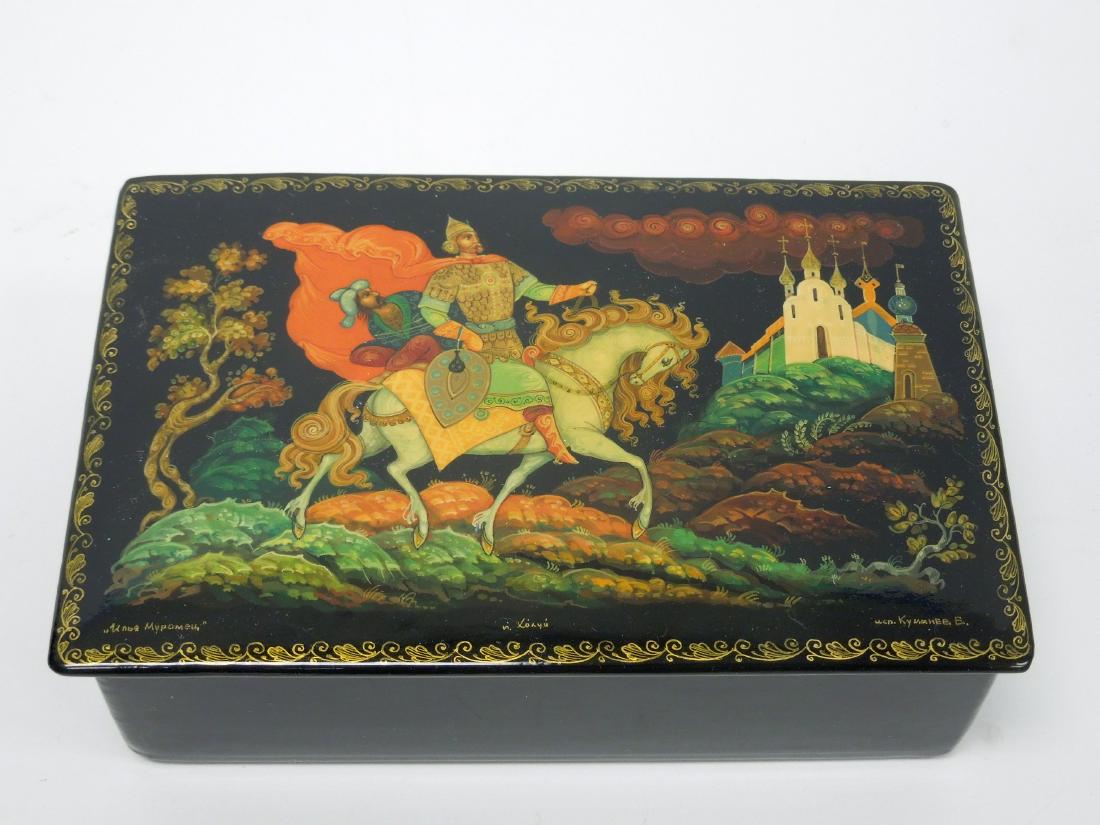 Kimarev Kholui Russian Lacquer Box.: Kimarev Kholui Russian lacquer box, Ilya Murometz. Rectangular hinge lid box. Signed and titled. (1 3/8" tall, 6 1/4" x 4").