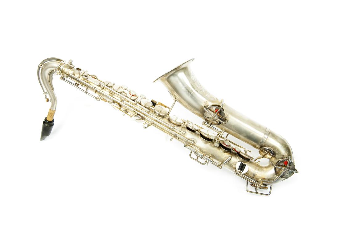 Buescher Tru-Tone Low Pitch Saxophone.: Buescher Tru-Tone Low Pitch Saxophone, 1922. (Serial no. 95750). With case.