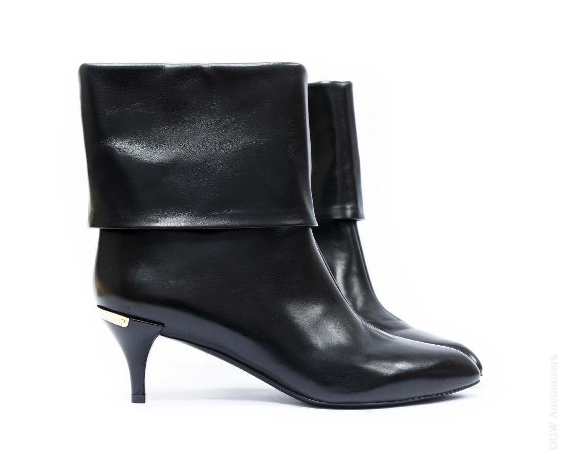 Pair of Louis Vuitton Boots.: Pair of lady's Louis Vuitton black leather low-heeled boots. Deep low cuffs, with signature gilt metal trim at the heels. Made in Italy. Size 38. (DE0141). In original box with two cloth protective ba