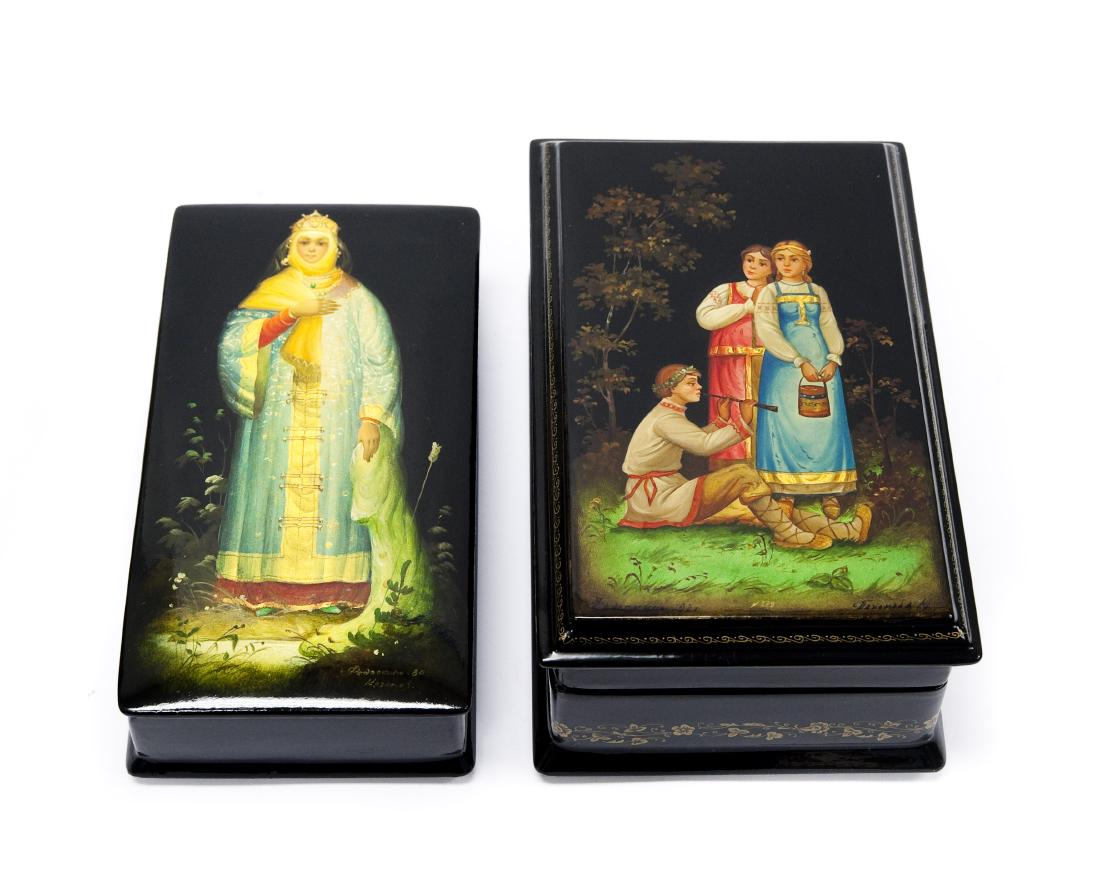 (2) Fedoskino Russian Lacquer Boxes.: (2) Fedoskino Russian lacquer boxes, Vasilisa and Flute Player. Rectangular boxes, signed, dated 80 & 92.