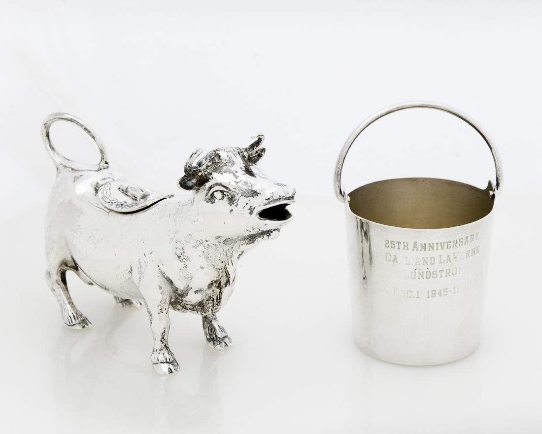 Shreve & Co. Sterling cow Creamer and Pail.: Shreve & Co. sterling silver creamer with hinged opening modeled as a bull. 7.14 ozt. And a Shreve & Co. San Francisco sterling silver pail with swing handle, #11129. 2.83 ozt.
