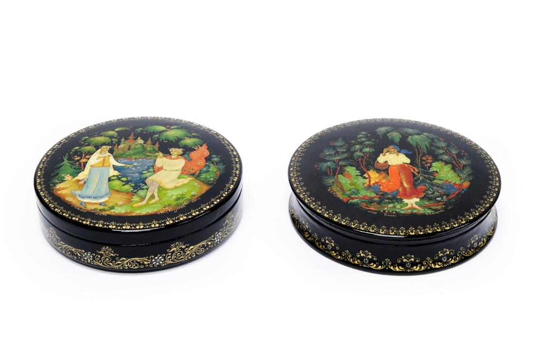 (2) Palekh Russian Lacquer Boxes.: (2) Palekh Russian lacquer circular boxes. Populova, Snow Maiden & Belousova, Calling for lover. Signed, dated 1994, 1982. (3 3/4 x 1 inches).