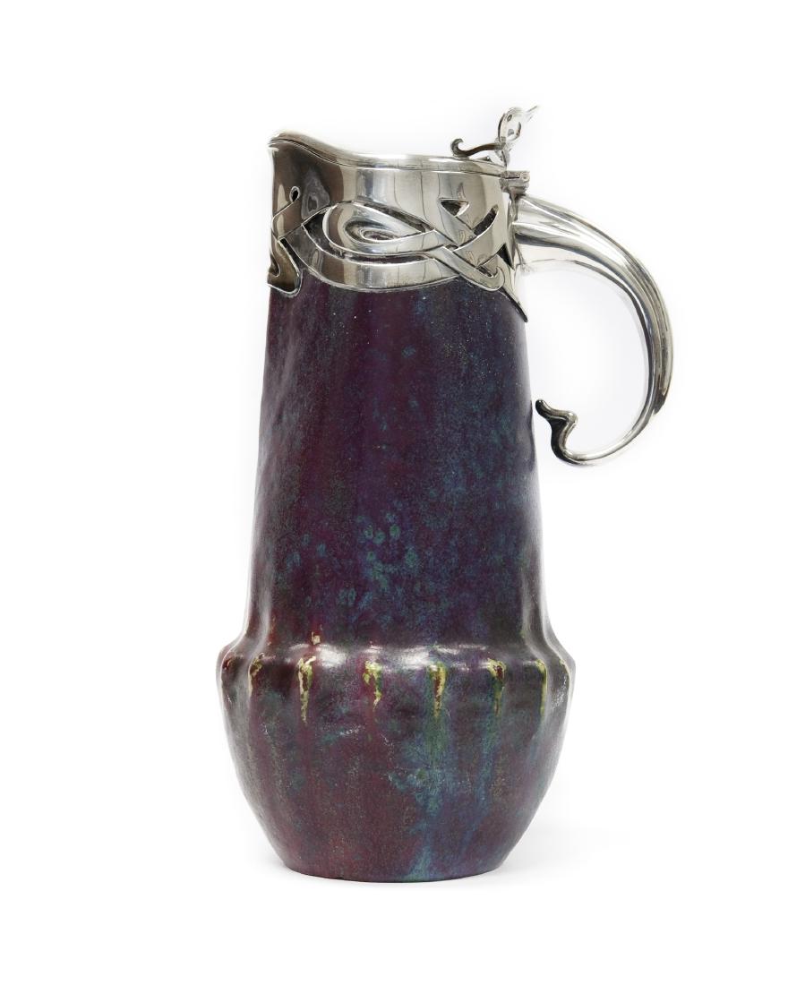 Dalpayrat Ceramic Pitcher with French Silver Neck &: Pierre Adrien Dalpayrat glaze ceramic pitcher with Alphonse Debain silver neck, lid and handle. Faded Dalpayrat mark on base, Debain Silver mark. (10 3/4 x 6 1/2 inches).