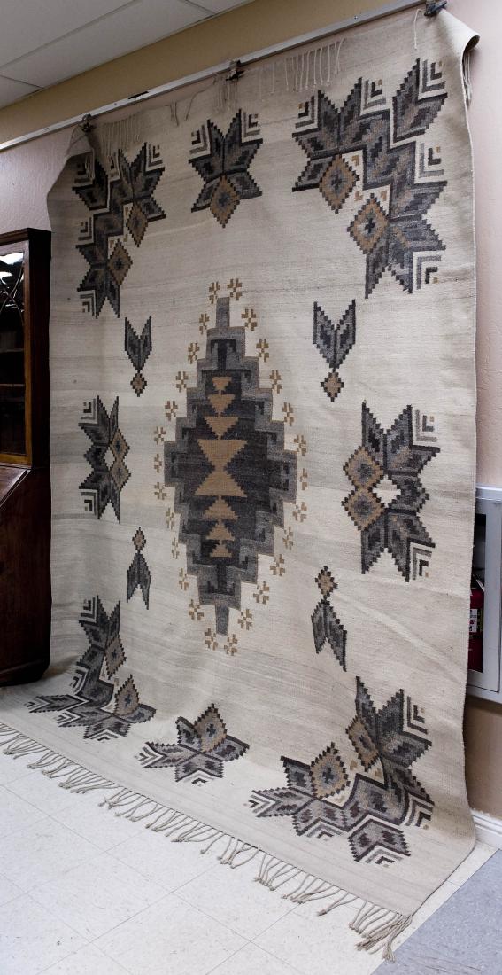 Southwestern Hand Woven Rug.: Southwestern hand woven rug. Beige ground with patterns in grey and brown. (11 x 7.5 feet).