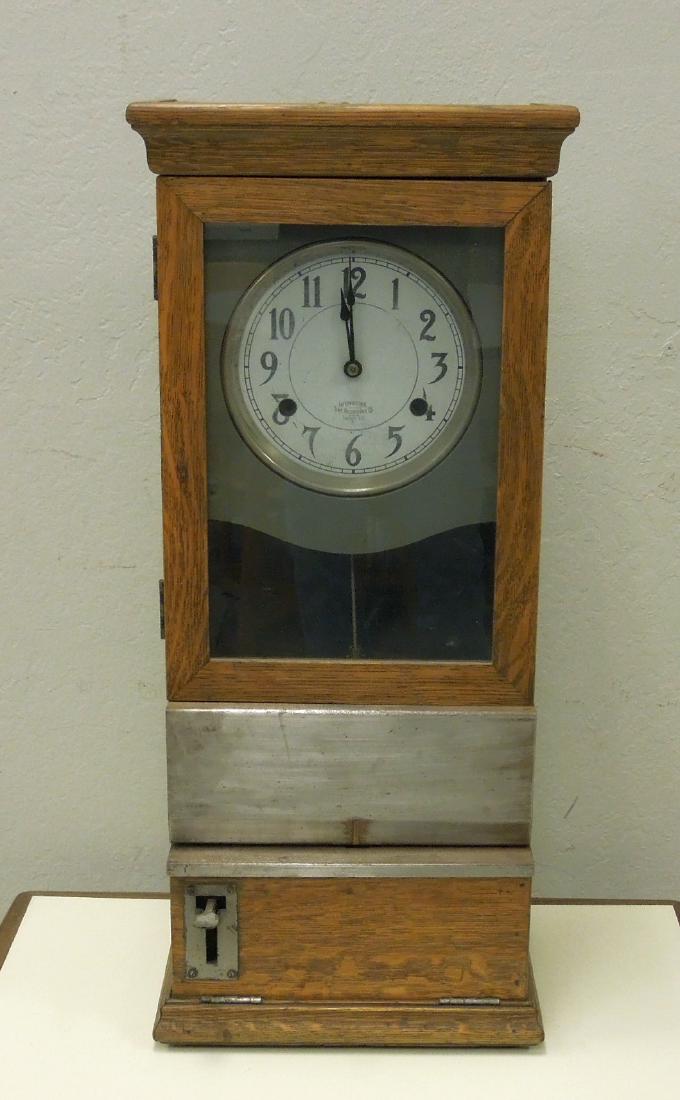 International Time Recording Co. Early 20th C. Time: International Time Recording Co., early 20th c. oak cased time card clock. (13 1/4 x 9 3/4 x 30 3/4 inches).