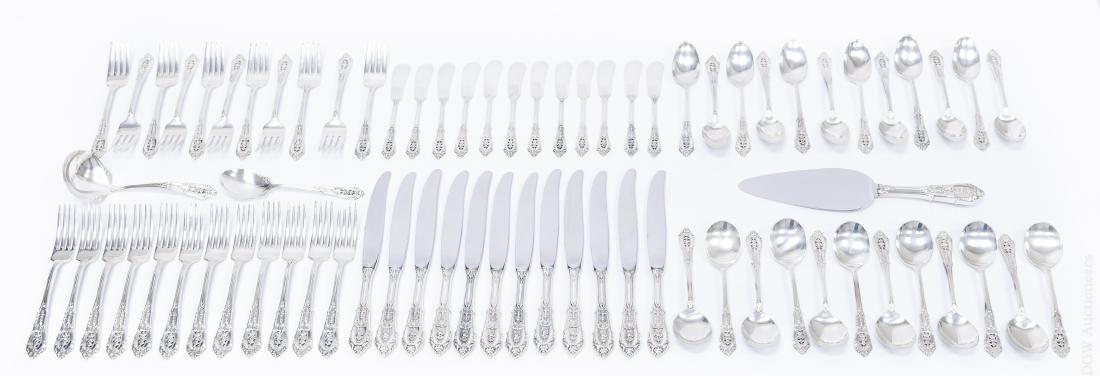 Wallace "Rose Point" Sterling Silver Flatware.: Wallace "Rose Point" Sterling Silver flatware service, 74 pieces. (12 dinner forks, 12 dinner knives, 12 soup spoons, 11 luncheon forks, 12 teaspoons, 12 butter knives, 2 serving spoons and a cake sli