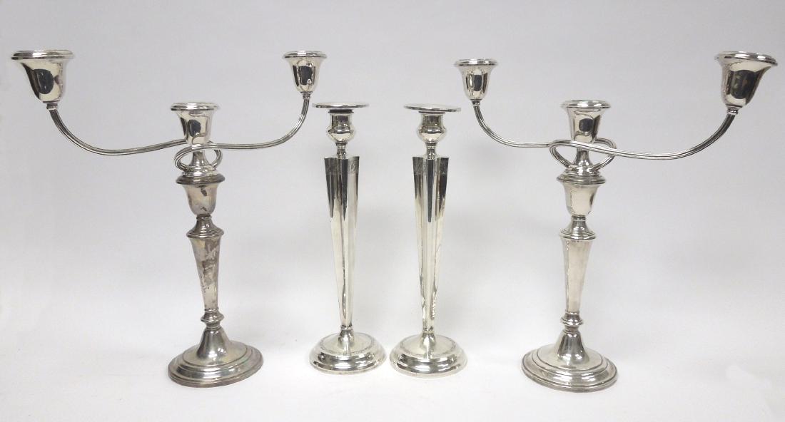 Two Pairs Sterling Silver Candle Holders.: Two pairs of sterling silver candleholders. Comprising a pair of Gorham cement-weighted candelabra. The three-light branch detaches, converting to single candlesticks. Model 674. Height overall: 14 1/