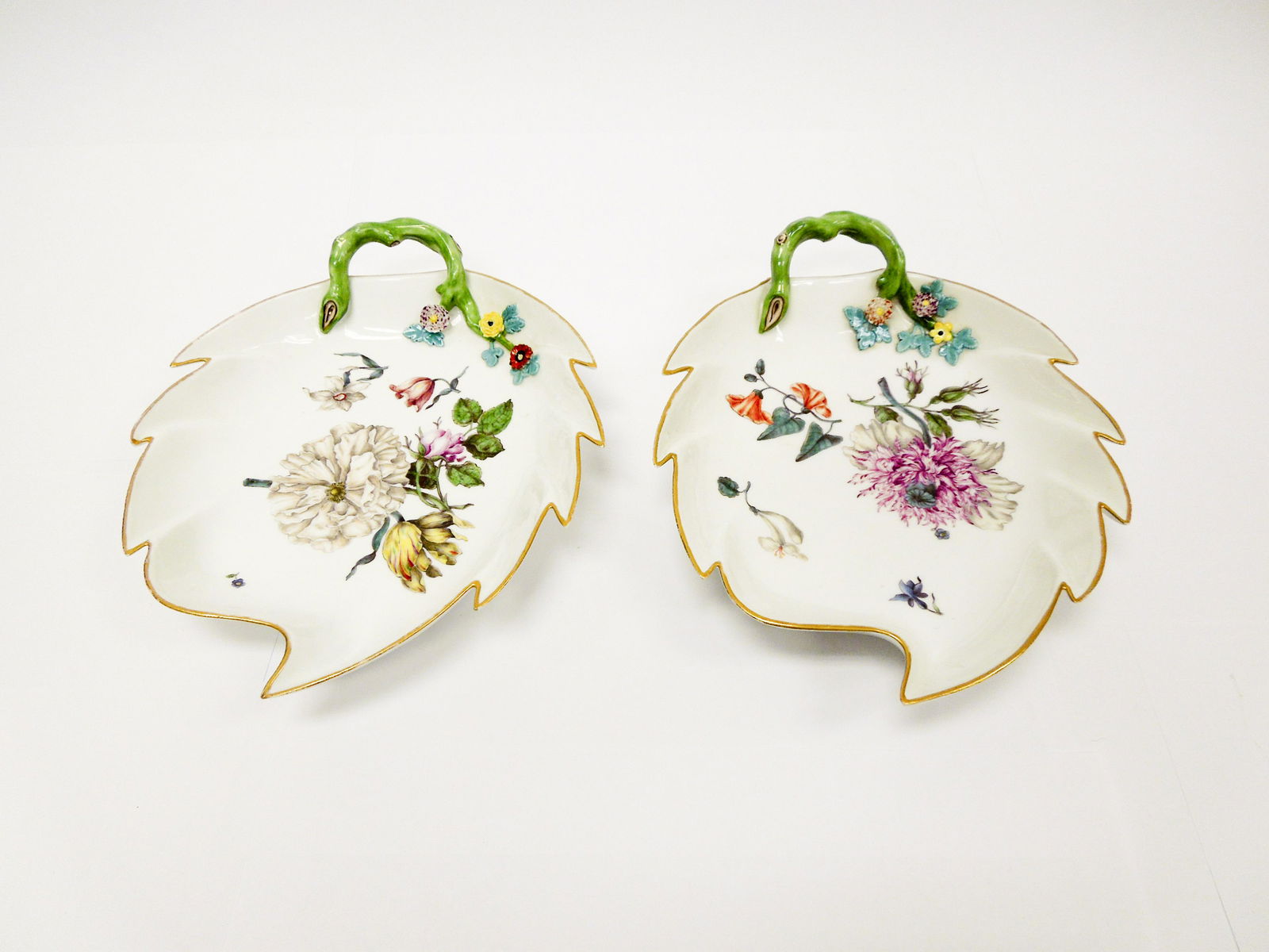 (2) Meissen Porcelain Leaf Dishes.: (2) Meissen porcelain leaf dishes. Blue cross swords mark. (8 3/4" x 7").