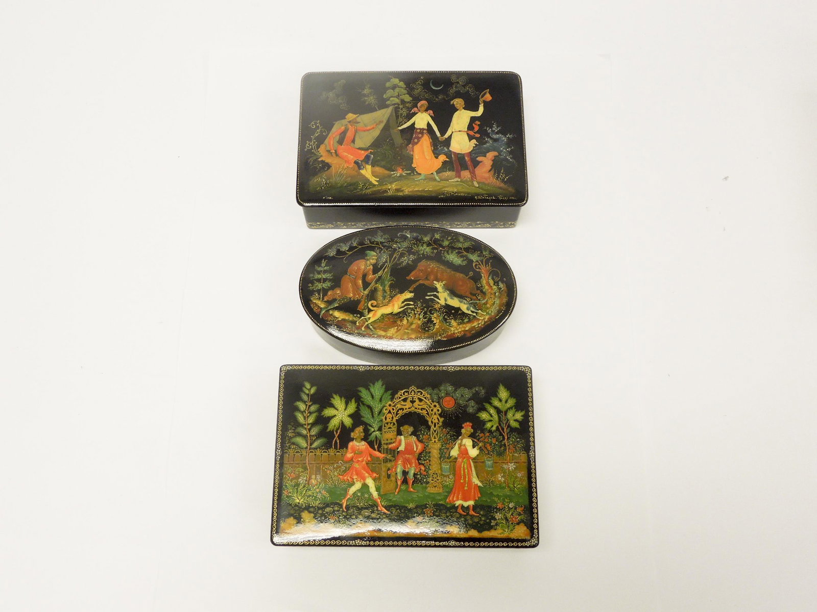 (3) Palekh Russian Lacquer Boxes.: (3) Palekh Russian lacquer boxes. Two rectangular and an oval box. Signed and dated. (6 x 4 1/4, 5 1/4 x 3 3/8, 6 x 4 inches).