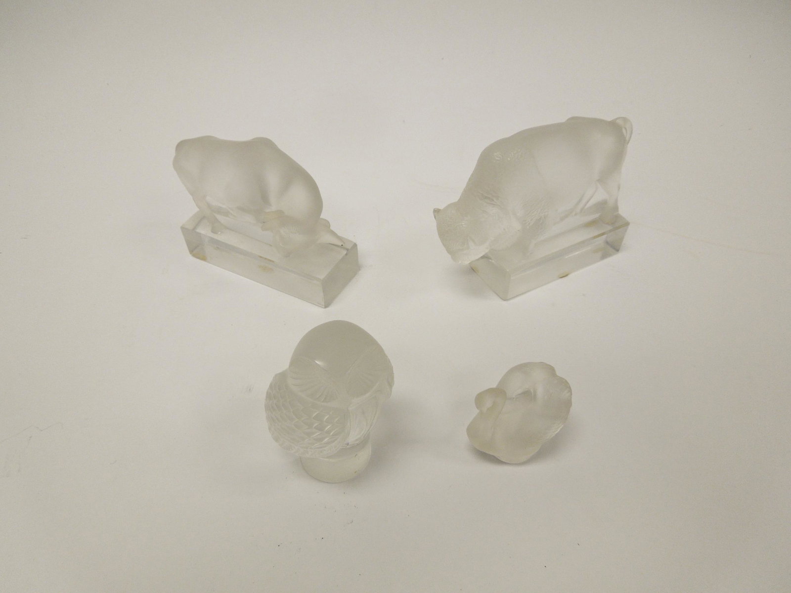 (4) Lalique Frosted Crystal Animal Figures.: (4) Lalique frosted crystal animal figures. Bison, Bull, Owl and Swan. (5 x 3 7/8 to 2 x 2 inches).