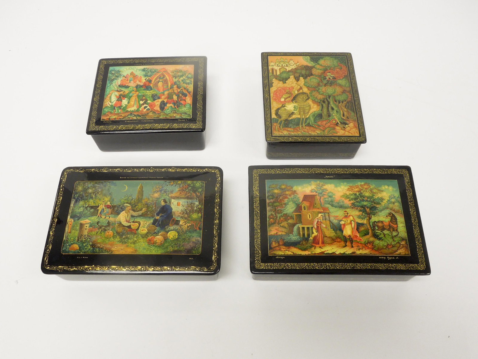 (4) Mstera Russian Lacquer Boxes.: (4) Mstera Russian lacquer boxes. Rectangular boxes, signed and titled. ((6 1/4 x 4 1/4, 6 1/4 x 4 1/4, 4 3/4 x 4 & 4 3/4 x 4 inches).