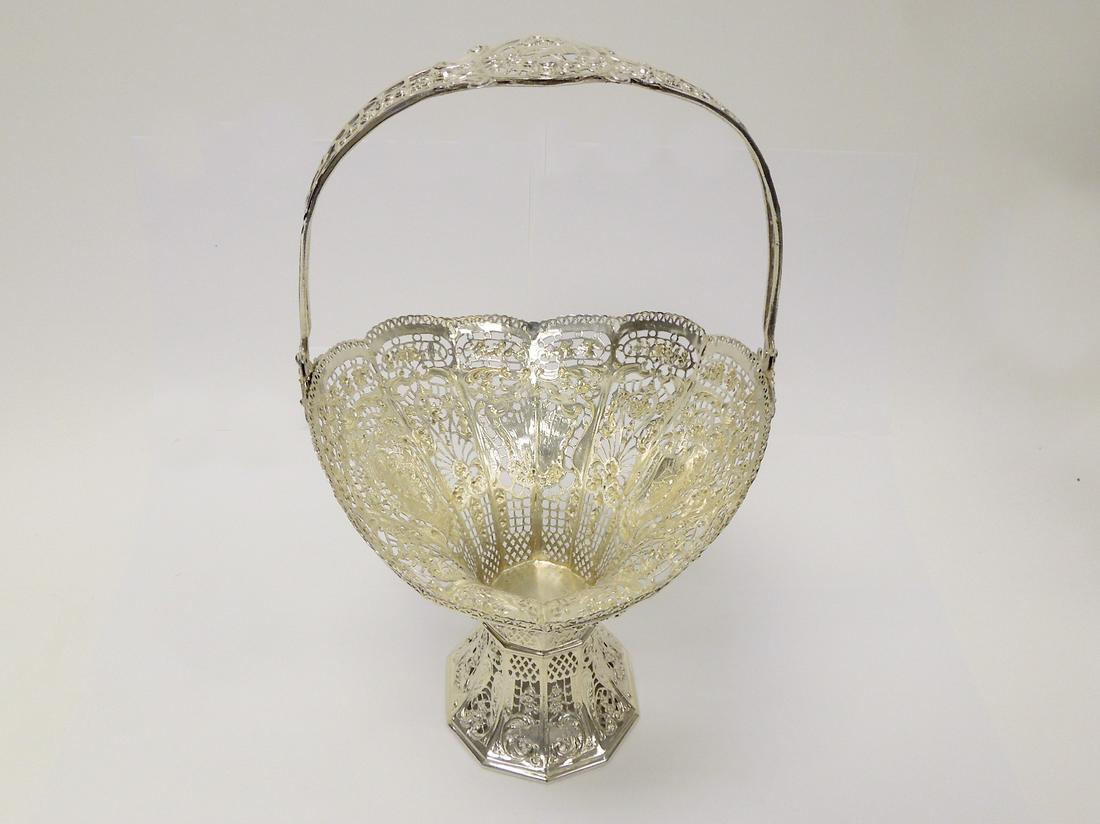 German 800 Silver Art Nouveau Tall Basket.: German 800 Silver Art Nouveau openwork tall basket with handle. With crown and 800 mark. (Handle up: 15 1/2 inches tall, handle down: 10 1/4 inches tall. 10 inches W x 9 inches D). (25.4 troy oz).