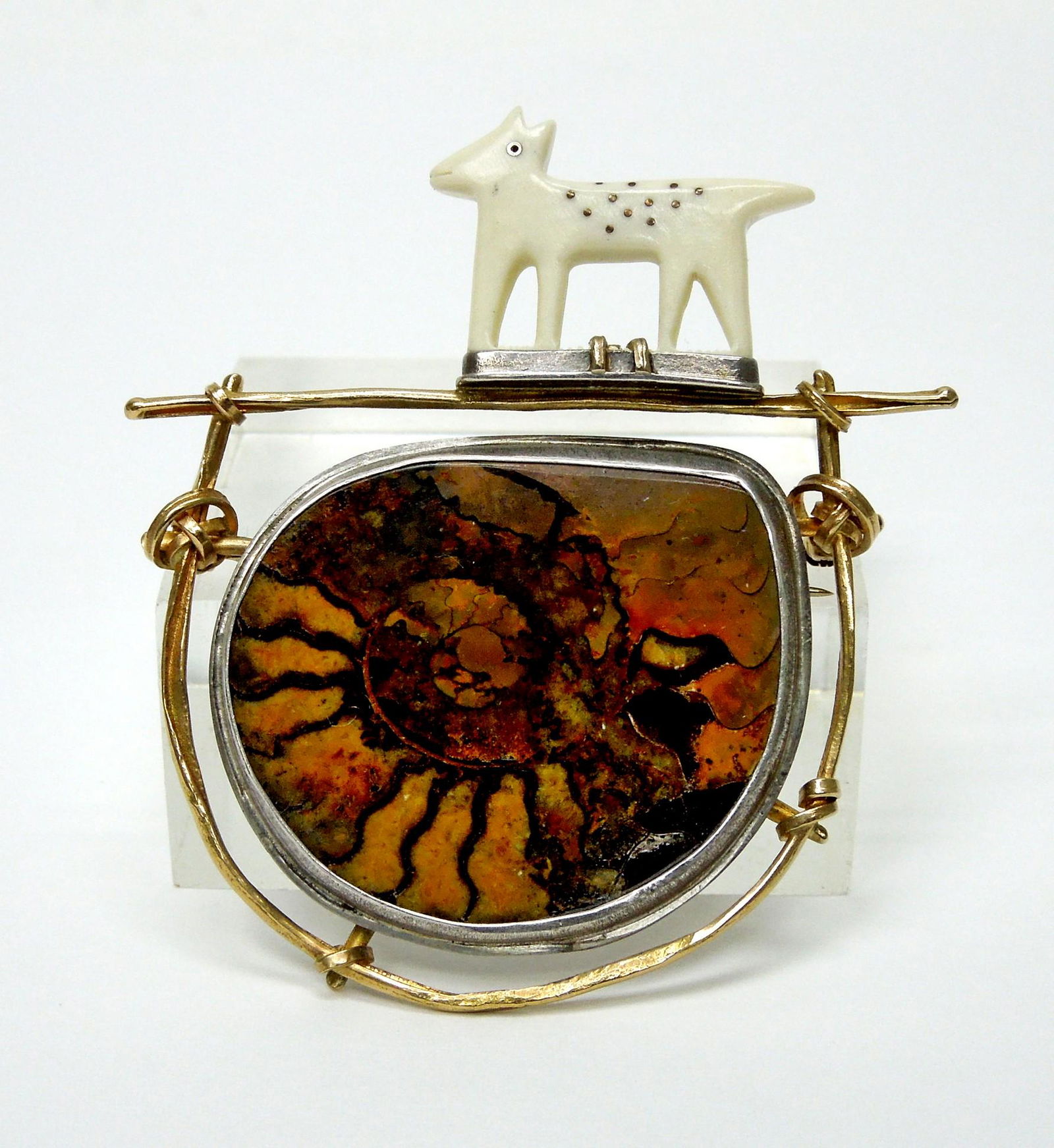 Carolyn Morris Bach 18K & Sterling Brooch.: Carolyn Morris Bach 18K Gold and Sterling Silver figurative spirits brooch. Abalone shell form in Sterling Silver surrounded by 18K Gold wire work with carved bone animal crest. Signed. (2 1/4 x 2 1/2
