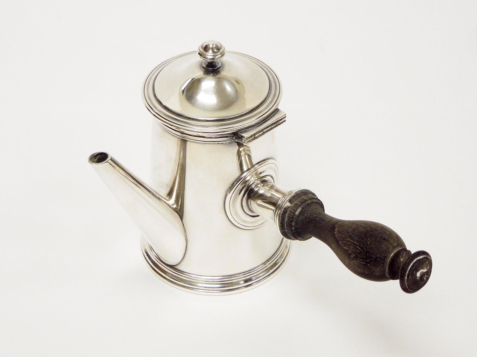 Christofle Silver Plated Teapot.: Christofle Silver plated teapot with wood handle. CC oval mark inside a square, 16 Silver content mark. (5" T, 6 3/4" L, 4 3/4" W).
