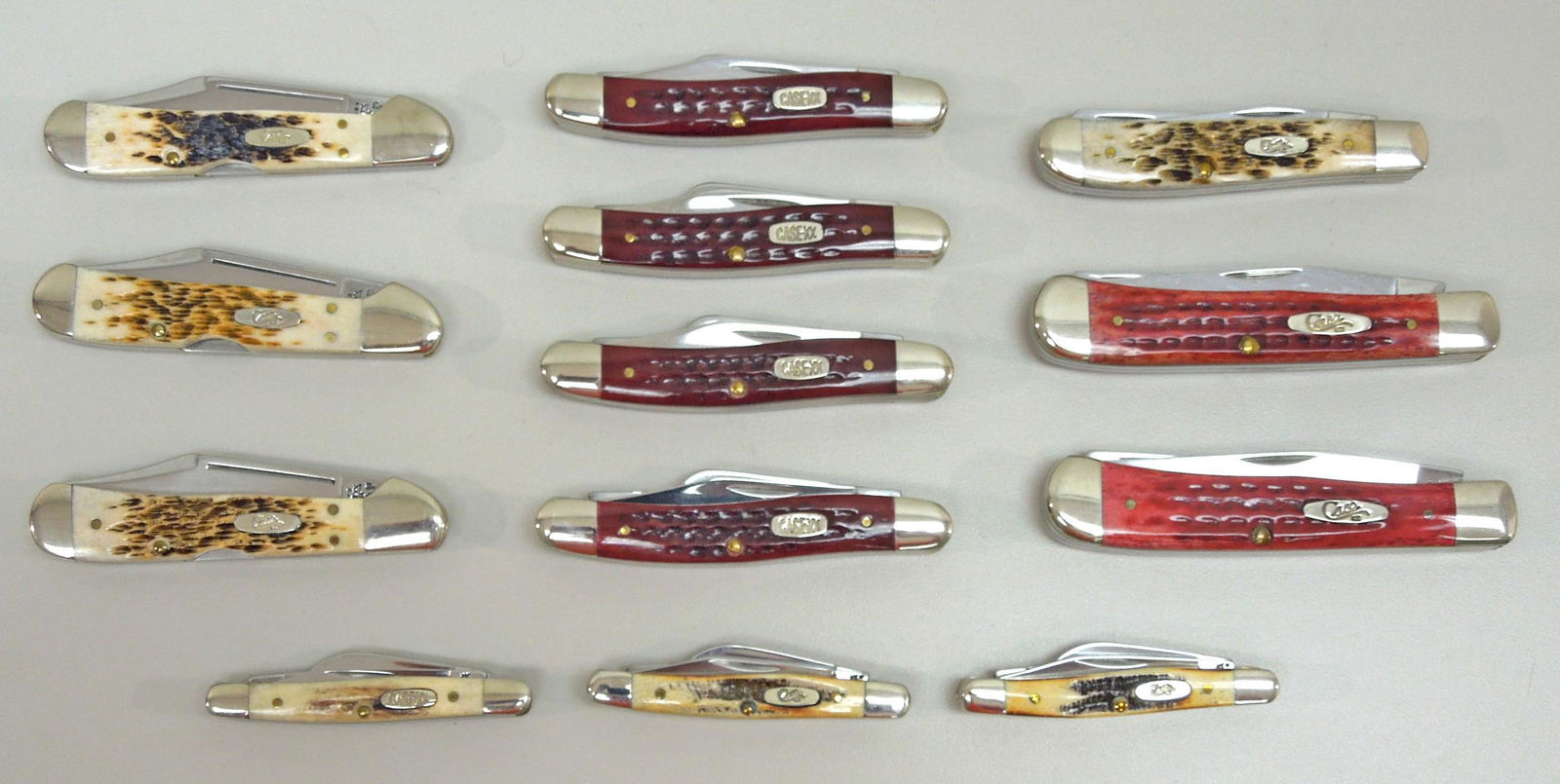 (13) Case XX Pocket Knives.: Group of (13) Case XX pocket knives, some with boxes. (3 x 65327 SS, 3 x 61749L SS, 2 x 6254 SS, 4 x 6318 SS, 1 x 6207 SS).