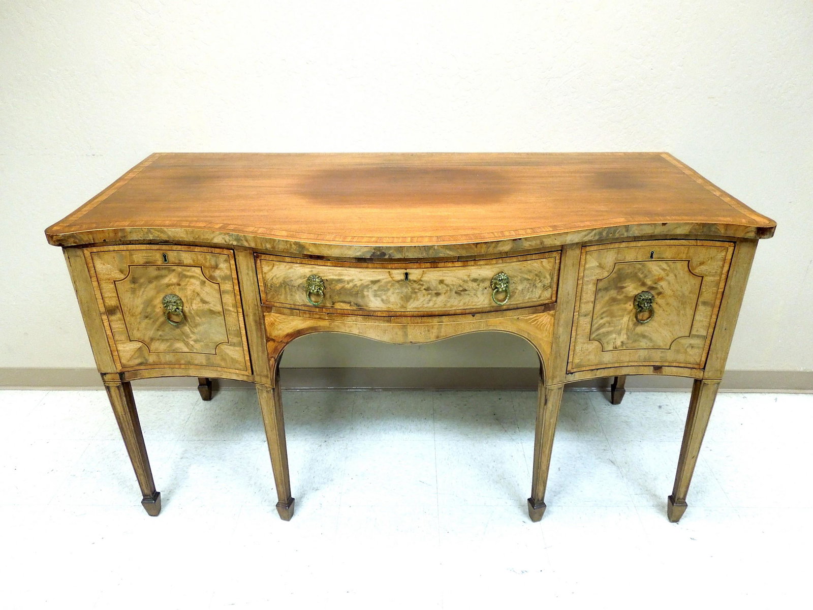 19th C. Hepplewhite Style Sideboard.: 19th C. Hepplewhite style sideboard. Mahogany and satinwood with ebonized cross band inlay. Single center drawer and 2 doors. (66" L, 30 3/4" D, 37 3/4" H).