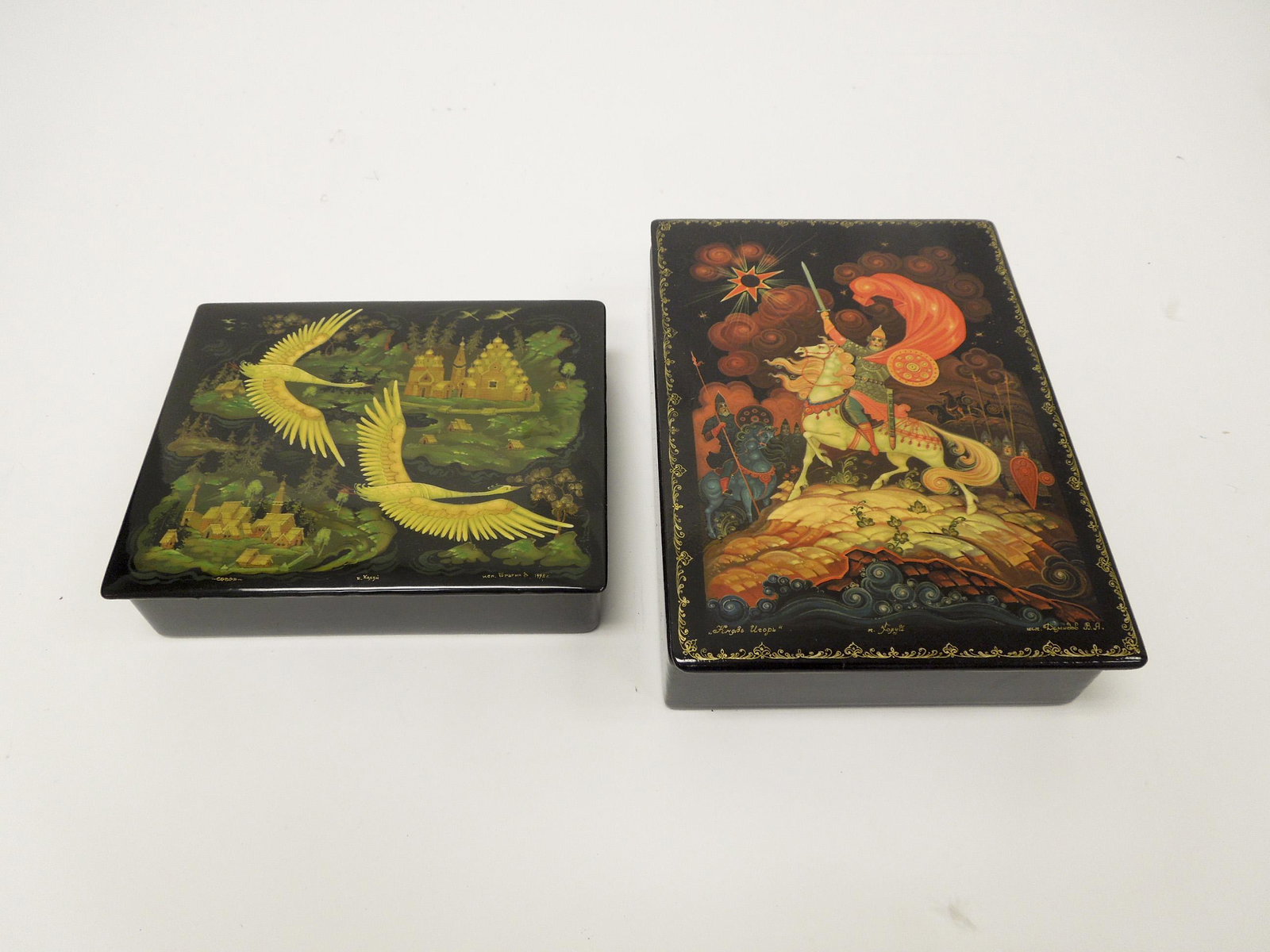 (2) Kholui Russian Lacquer Large Boxes.: (2) Kholui Russian lacquer large boxes. Prince Igor by Demidov and Two Geese by Bragin. (8 3/8" x 6" x 2" & 6 3/4" x 5 1/2" x 1 1/2").