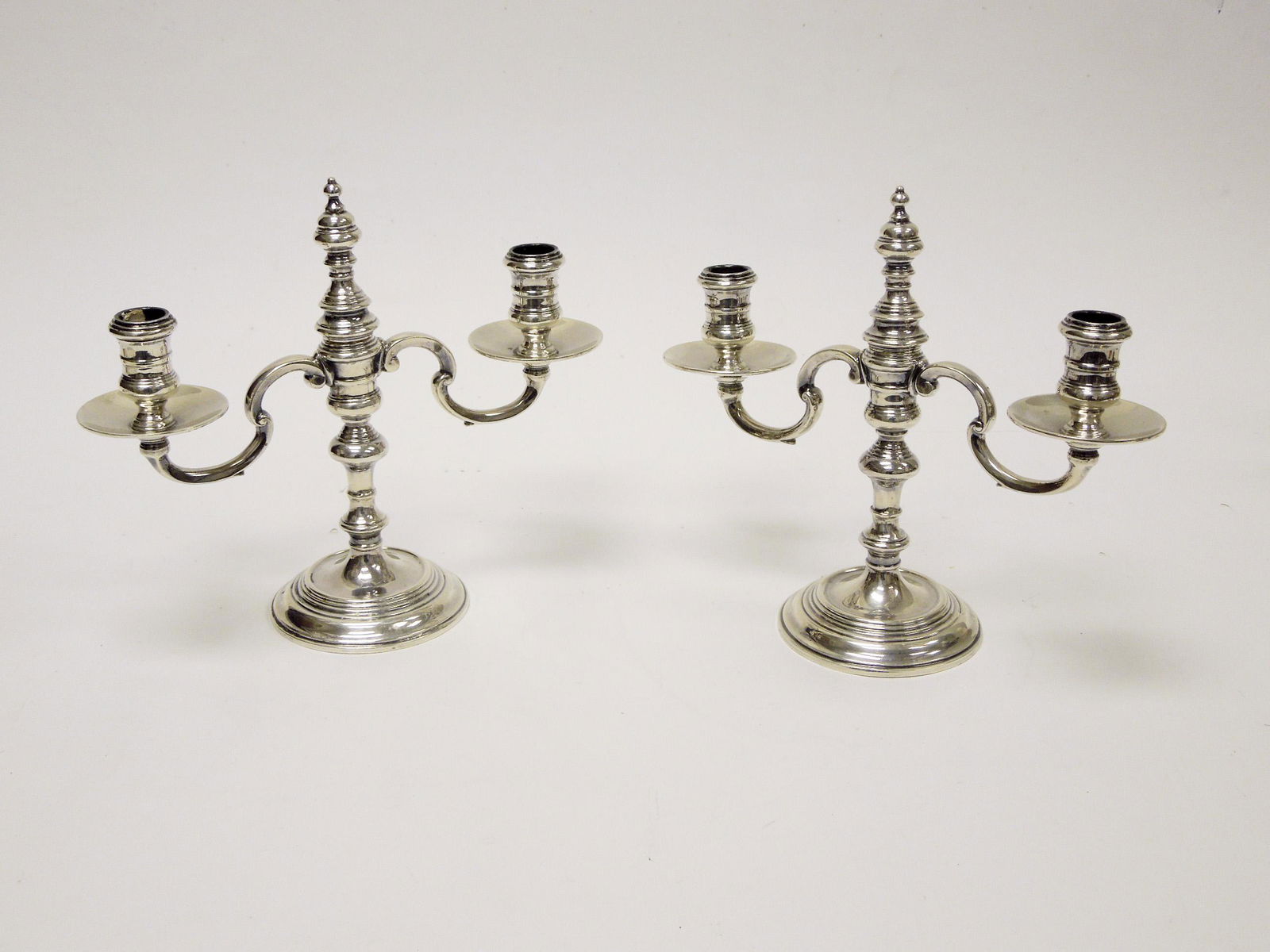 Pair of English Silver Candelabra.: Pair of English Silver candelabra. William Comyns & Sons, London 1954. 2-light candelabra convertible to 3-light. 7 3/4" tall, 9 1/2" wide. 27.5 troy oz.