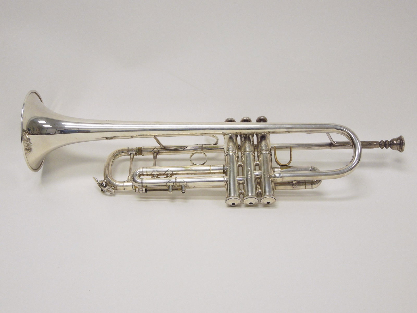 Bach Stradivarius Model 37 Trumpet.: Vincent Bach Stradivarius Model 37 trumpet, Serial number 402527. With 3 associated mouthpieces and case.