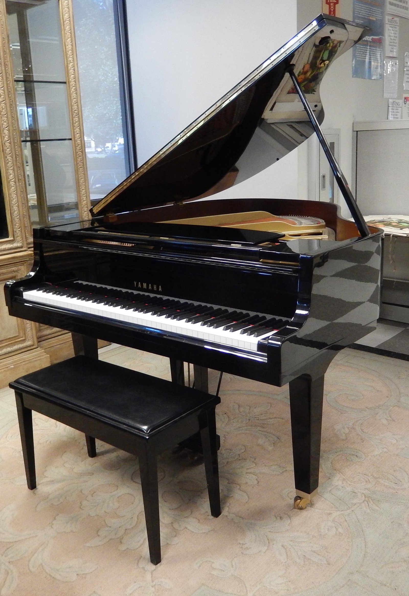 Yamaha Model GH1B Baby Grand Piano.: Yamaha model GH1B black ebonized baby grand piano. Serial number B4991013, manufactured 1991. With bench.