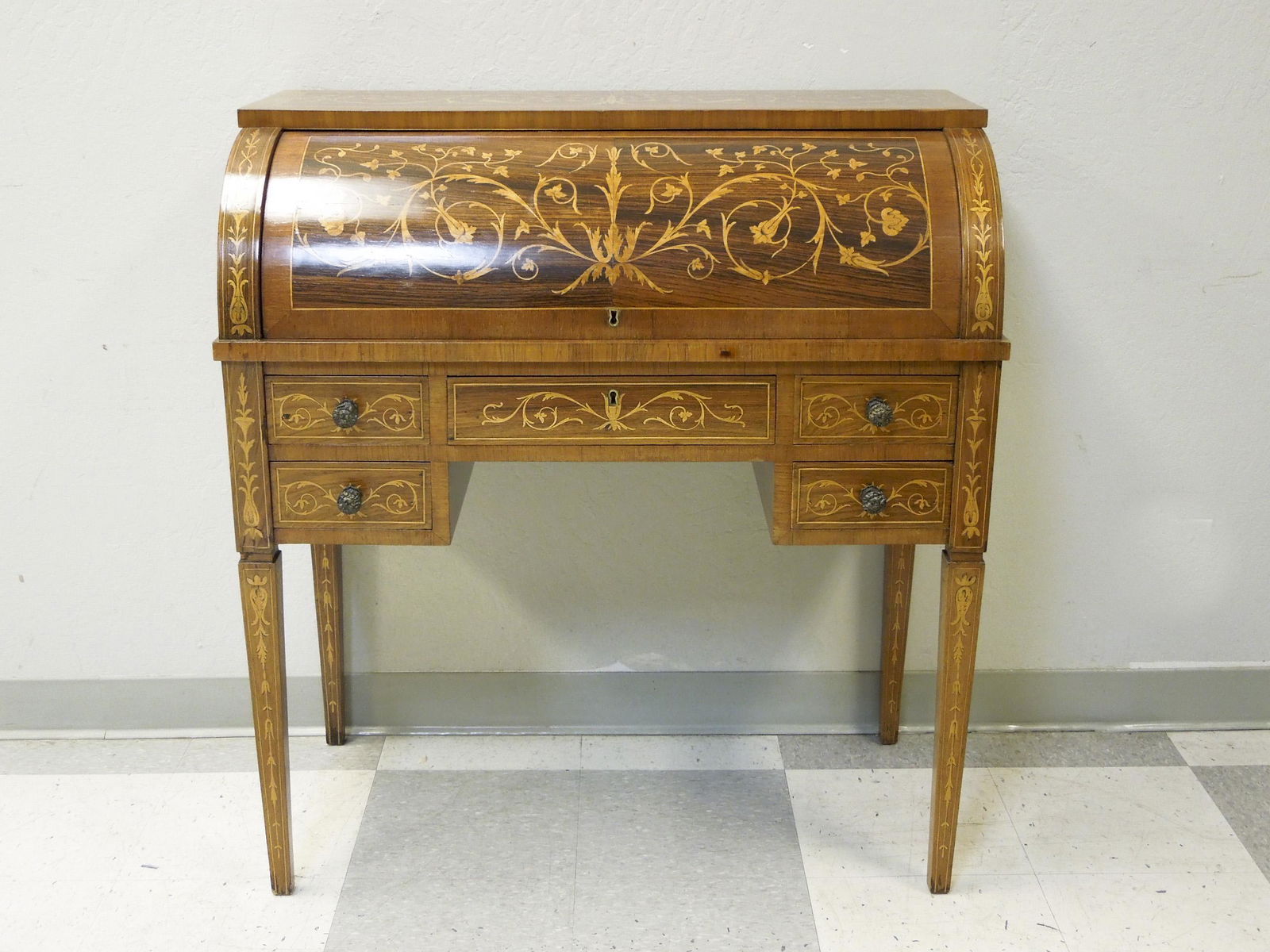 Italian Marquetry Inlay Cylinder Desk.: Italian marquetry inlay cylinder desk. The lower section with 5 drawers, roll top front with 4 drawers and 2 shelves. 36" L, 19.5" D, 39" H.