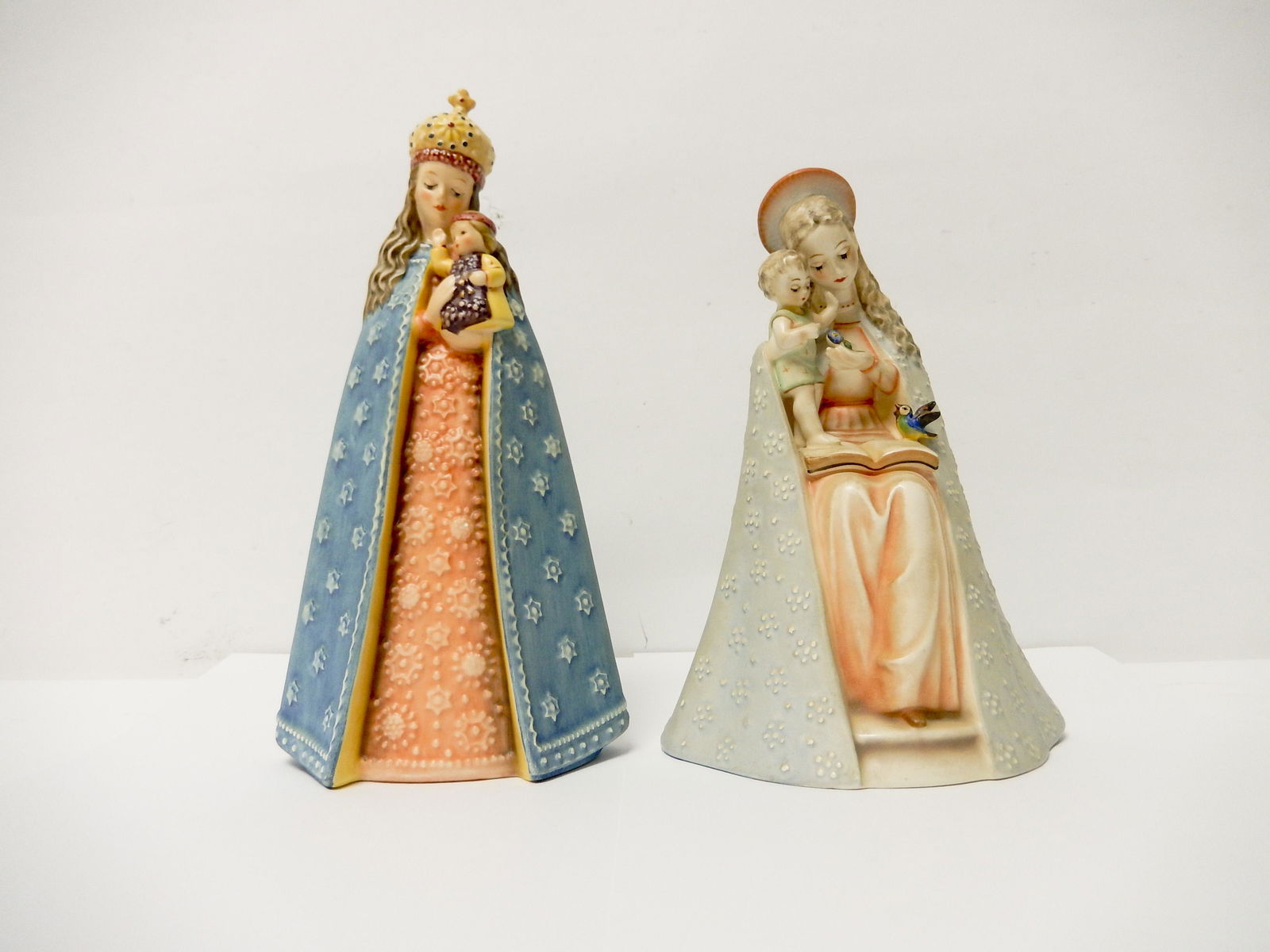 Two Hummel Madonna Figures.: Two Hummel Madonna figures, 8 & 9 inches tall. One with W. Germany, Stylized Bee mark; The other Goebel W. Germany 1909 -1984 75th Anniversary.