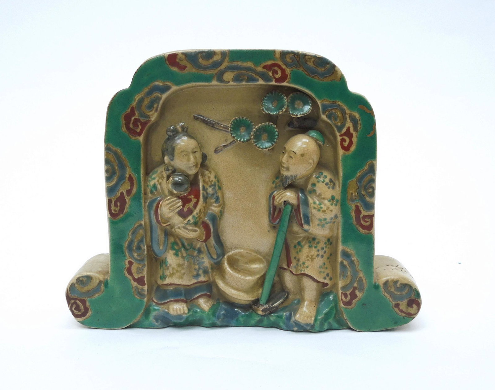 Japanese Wall Pocket.: Japanese Kiyomitsu-yaki (Kyoto ceramic) wall pocket vase, modeled in the shape of a tile decorated with figures in relief. 19th C. 6 in. x 1 1/2 in. x 7 1/2 in.