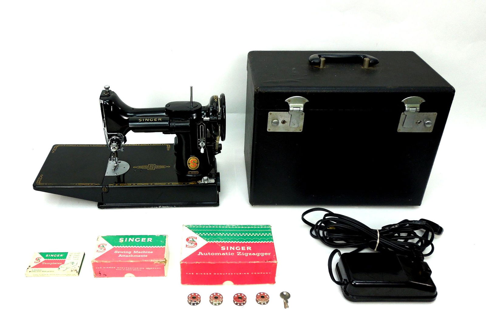 Singer 221K Featherweight Sewing Machine.: Singer 221K Featherweight sewing machine. Serial No. ES243701 (1961). With case, bobbin, Zigzagger and attachments.