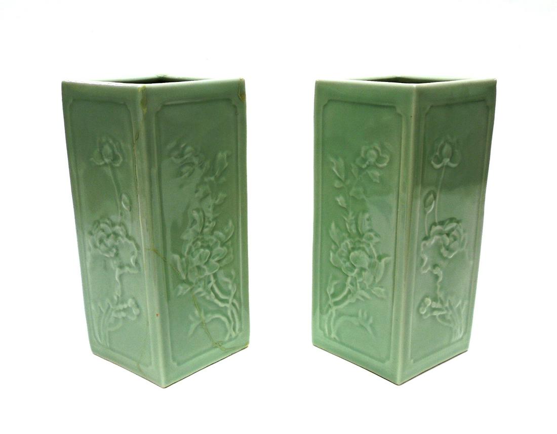Pair of Chinese Celadon Vases.: Pair of Chinese vertical square diamond shape celadon vases, the sides modeled with four season floral designs. Incised Qianlong seal on bases. Early 20th C. Height: 10 1/4 in. * One vase cracked and 