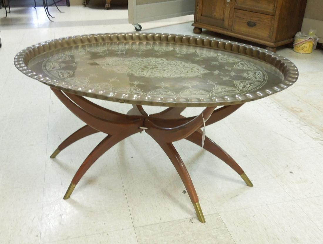Mid 20th C. Oval Brass Tray Table with Folding Base.: Mid 20th C. Oval brass tray table with folding splay leg base. 39.5" L, 29" W, 19.5" H.