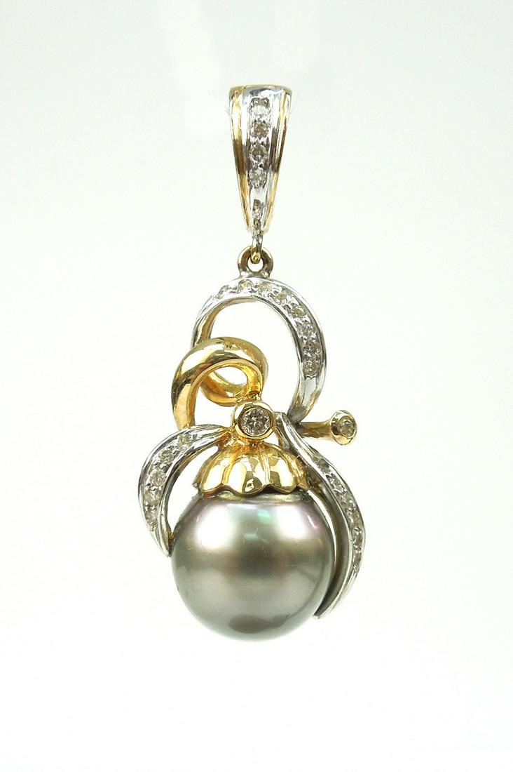 Treated Black Pearl and Diamond Pendant.: A treated black pearl approximately 13.9 millimeters and 35 round full cut diamonds in white and yellow gold setting. Total diamond weight estimate .36 carats.