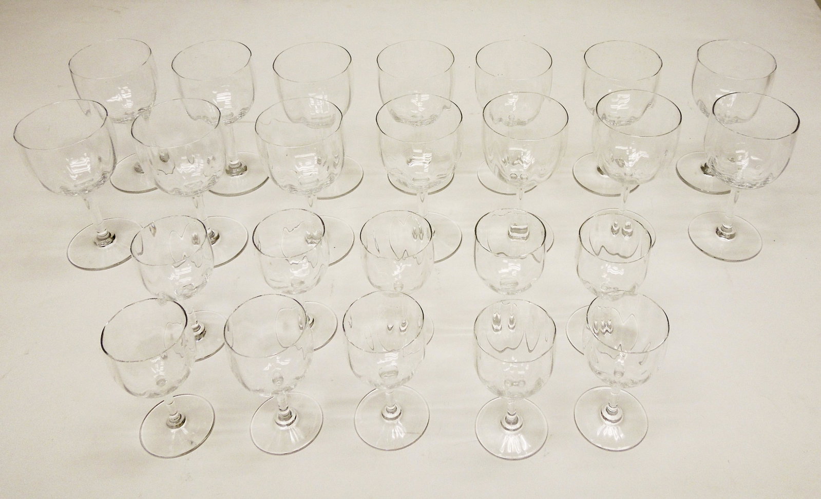 (23) Baccarat Montaigne Optic Stemware.: Group of Baccarat Montaigne Optic stemware, 24 pieces. 14 Water goblets (6 3/8") and 10 Port Wine glasses (4 7/8"). With associated storage boxes.