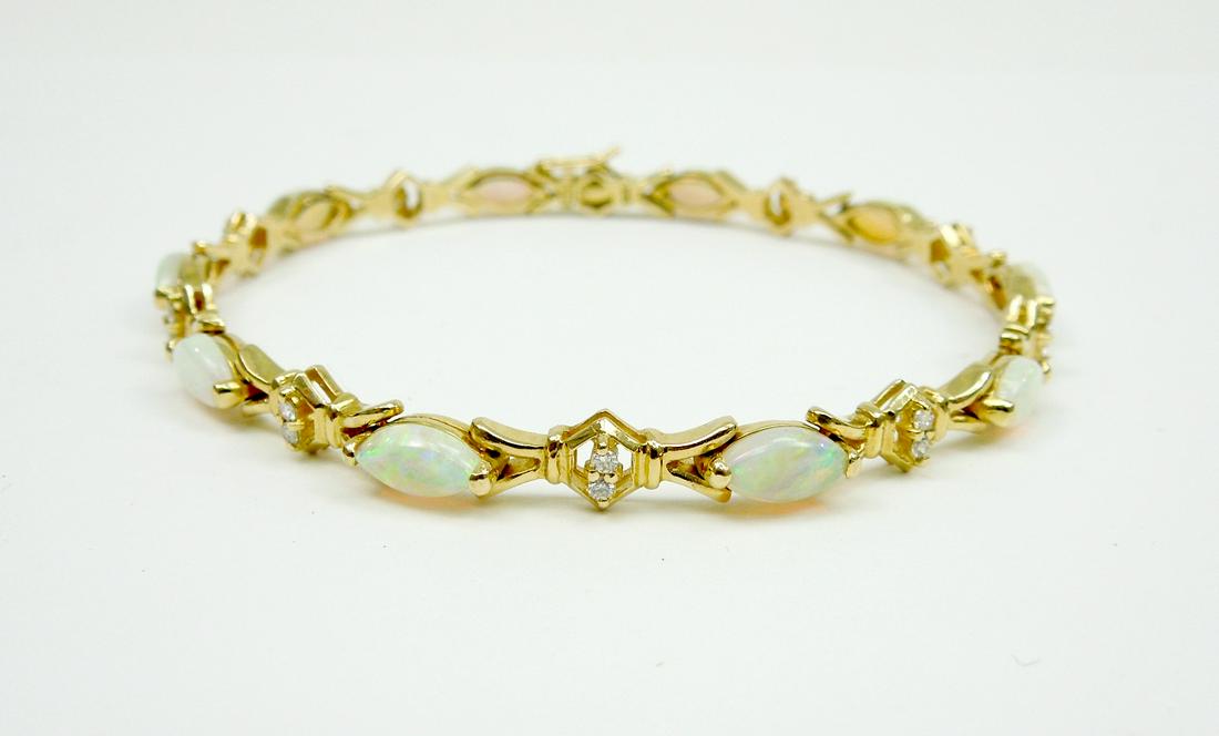 14K Opal and Diamond Bracelet.: Opal and diamond bracelet with 10 marquise cut opals and 20 round full cut diamonds in a yellow gold bracelet tested 14k. Total opal weight estimate 5.00 carats, total diamond weight estimate 25 carat