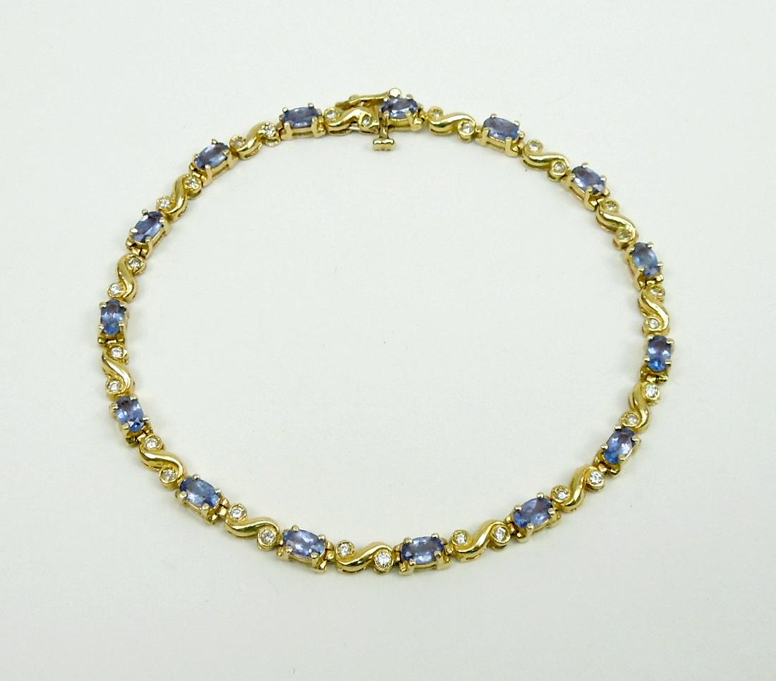 14K Gold, Diamond and Tanzanite Bracelet.: Diamond and tanzanite bracelet with 20 oval tanzanites and 30 round full cut diamonds in a yellow gold bracelet stamped 14k. Total tanzanite weight estimate 3 karats, total diamond weight estimate .45