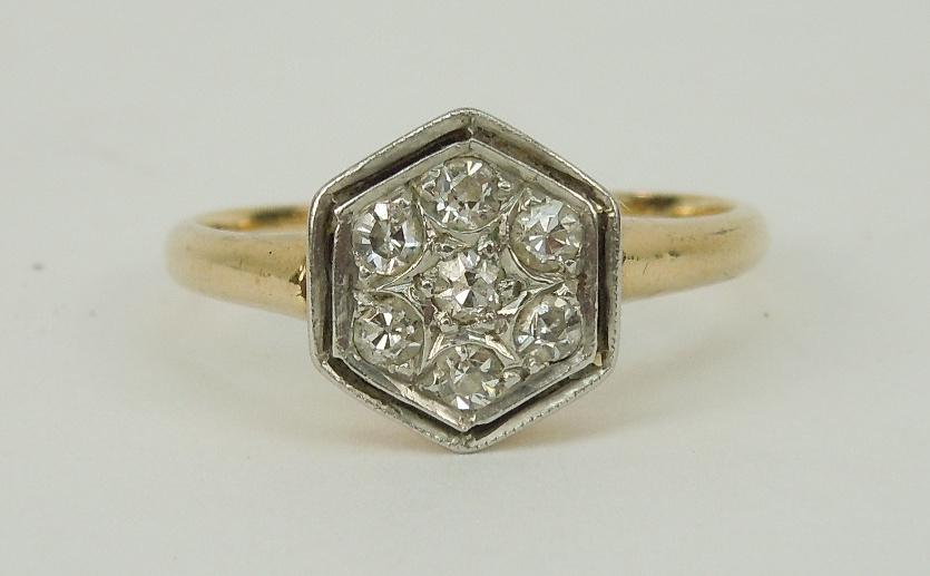 14K Yellow Gold Ring with Diamond Accents.: 14K Yellow gold ring with (7) full cut accent diamonds. (2 grams).