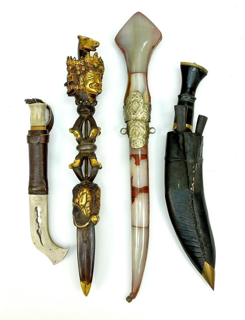 Collection of Dagger Replicas.: Group of collectible daggers (4), including a bronze Tibetan Buddhistic pestle dagger; a tin-clad agate handled and sheathed dagger; a Nepalese Gurkha horn handled and wood sheathed dagger and a hand 
