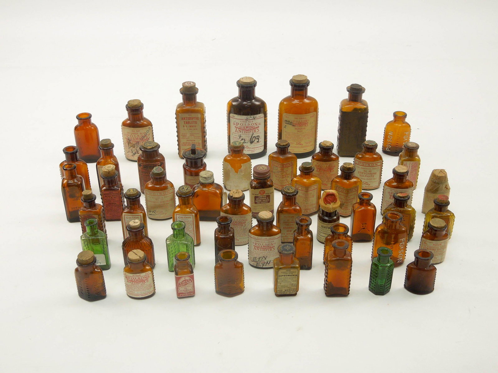 Collection of Vintage Apothecary & Poison Bottles.: Collection of vintage apothecary and poison bottles. (Brown glass).