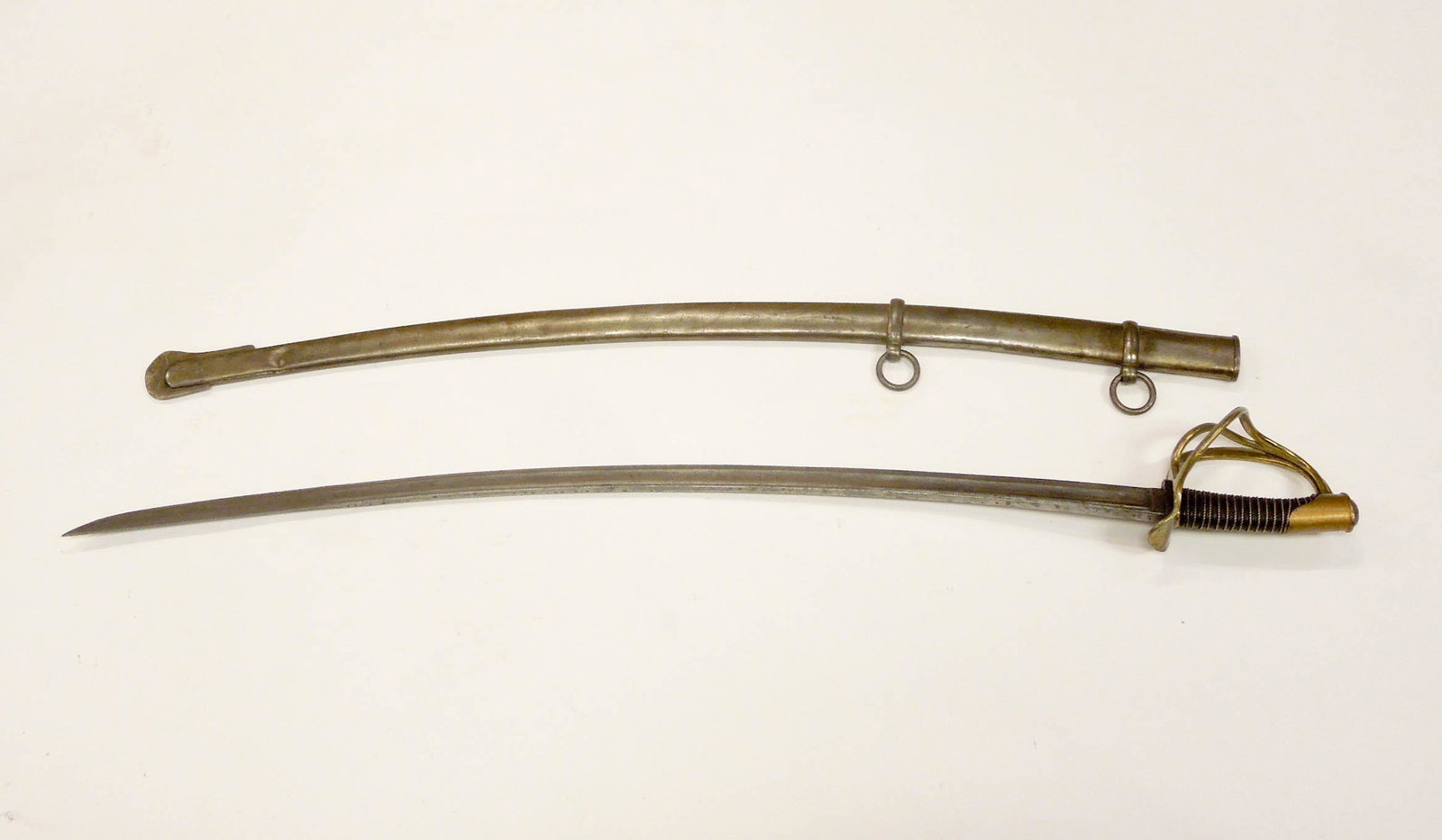 Schnitzler & Kirschbaum Heavy Cavalry Saber.: Schnitzler & Kirschbaum type M-1840 heavy cavalry sword also known as "old wrist breaker". Ricasso stamped S&K. Approximately 41 inches in overall length, blade length 35.5 inches. Wire bound leather 