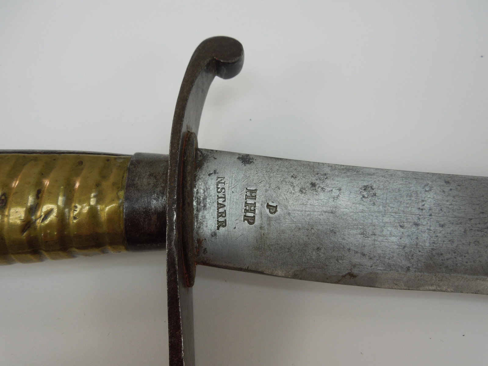 Nathan Starr Model 1812 Cavalry Saber.: Nathan Starr model 1812 cavalry saber. Ricasso stamped with P, H.H.P. and N.STARR. The curved blade is approximately 33.5 inches long, single edged steel, with a clipped point. The knuckle bow has an 