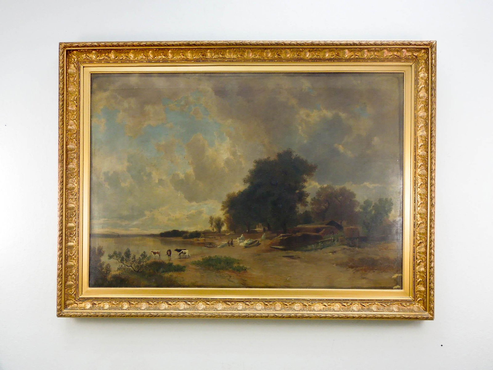 Gilt framed Oil on Canvas, Riverfront Landscape.: Continental School, Oil on canvas, riverfront landscape with cows, boats and trees. No apparent signature. Gilt framed. 36" x 52". Overall: 44" x 60 3/4".