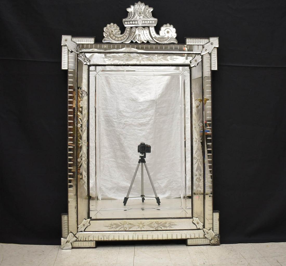 Antique Venetian Glass Wall Mirror.: Antique Venetian cut and etched glass wall mirror. Corona and scroll pediment, floral etched inner border frames the rectangular mirror plate with concave beveling. Etched appliques decorate the outse