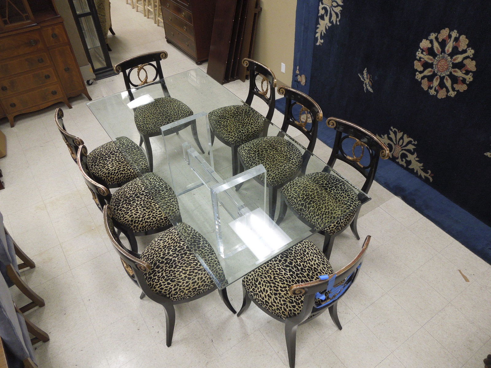 Contemporary Large Glass Top Table with 8 Chairs.: Contemporary large rectangular glass top table with 8 leopard skin print upholstered seat chairs. On Lucite base. 88" L, 44" D, 30" H.